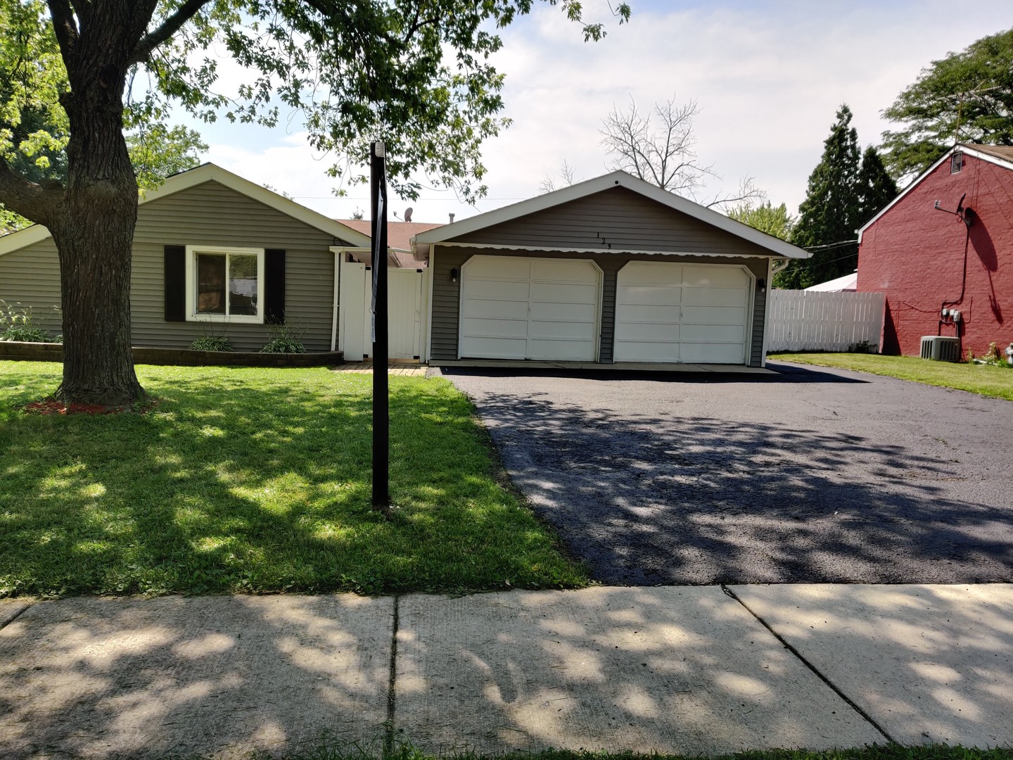129 Kingston Road Bolingbrook, IL 60440 - Photo 1 of 37 a house that has a tree in front of it