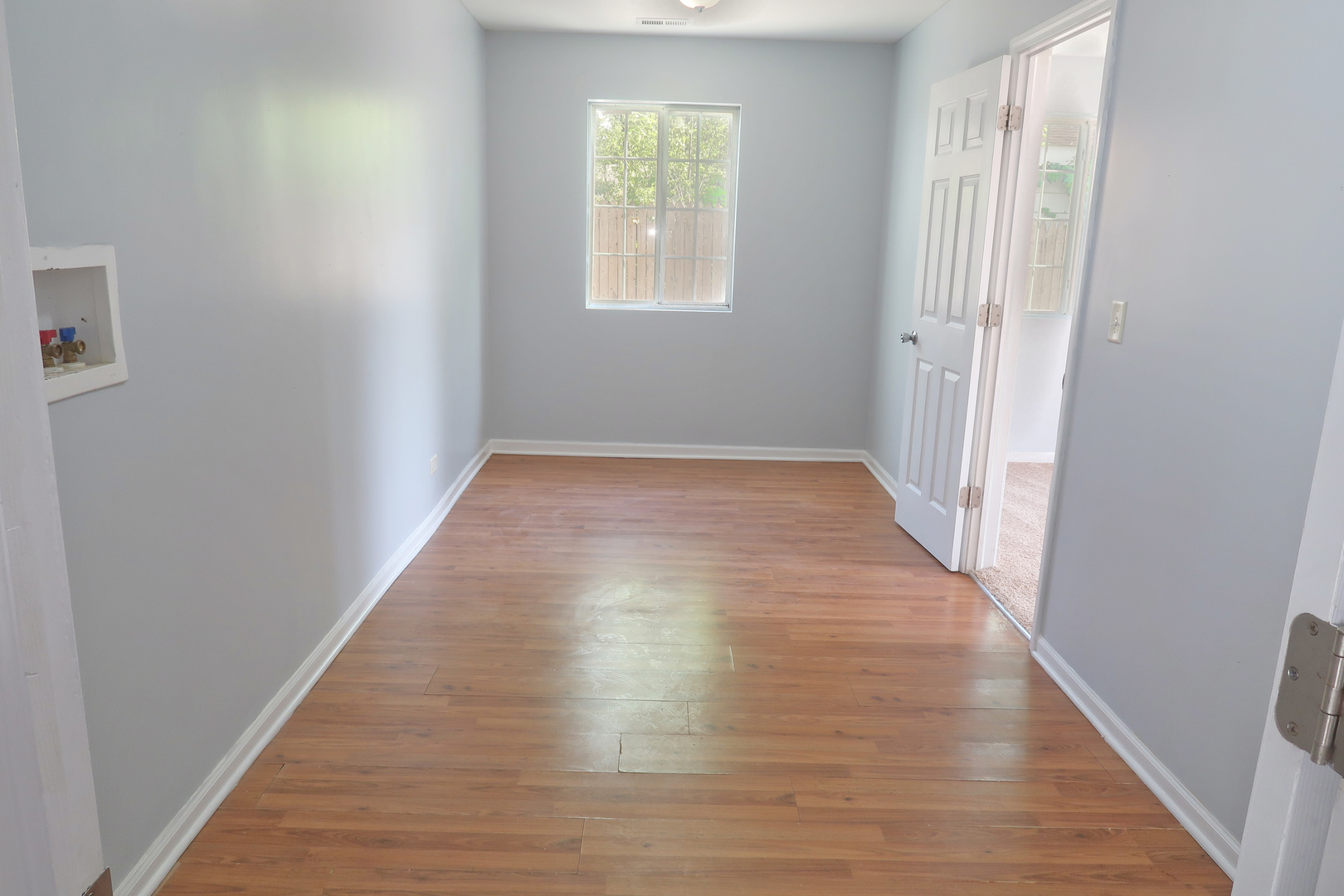 129 Kingston Road Bolingbrook, IL 60440 - Photo 19 of 37 an empty room with wooden floor and windows