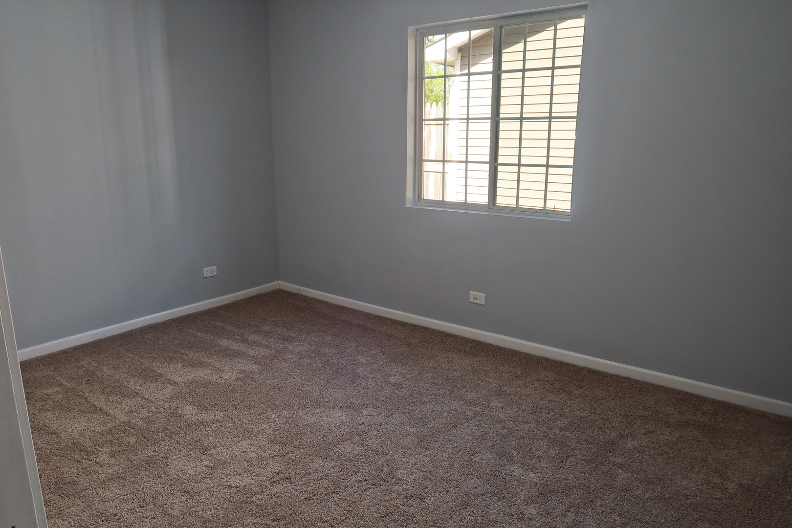 129 Kingston Road Bolingbrook, IL 60440 - Photo 23 of 37 an empty room with a window