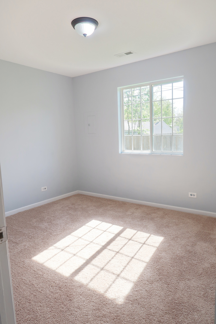 129 Kingston Road Bolingbrook, IL 60440 - Photo 30 of 37 an empty room with windows