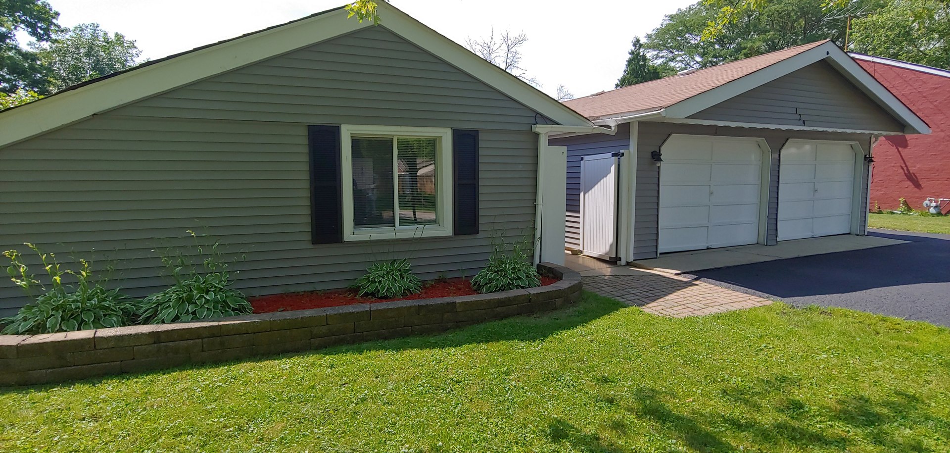 129 Kingston Road Bolingbrook, IL 60440 - Photo 4 of 37 a front view of a house with a yard