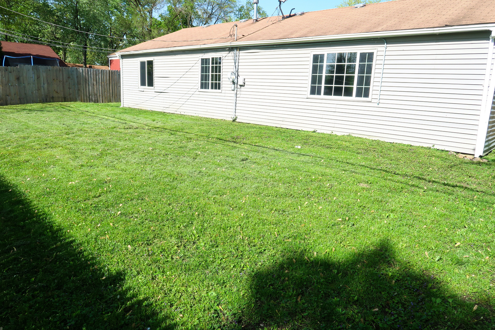 129 Kingston Road Bolingbrook, IL 60440 - Photo 37 of 37 a view of a backyard with plants and a backyard