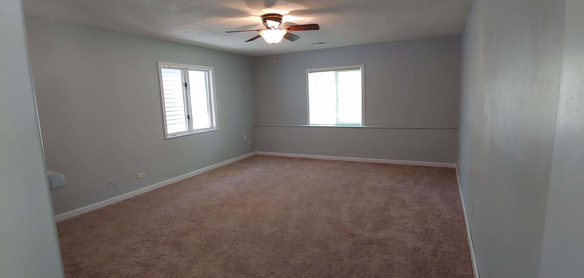 129 Kingston Road Bolingbrook, IL 60440 - Photo 10 of 37 en empty room with windows and chandelier fan