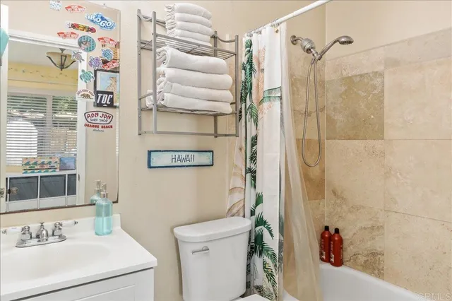 a bathroom with a sink and a shower curtain