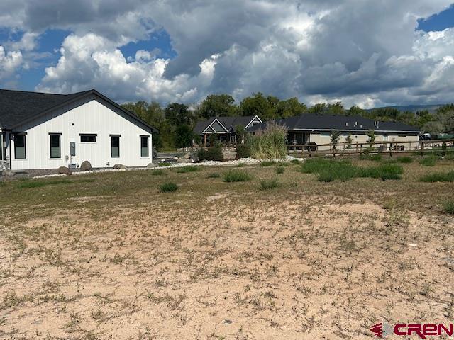 320 Southeast Limestone Court Cedaredge, CO 81413 - Photo 2 of 8 a view of a house with a yard