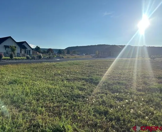 a view of an ocean with a mountain in the background