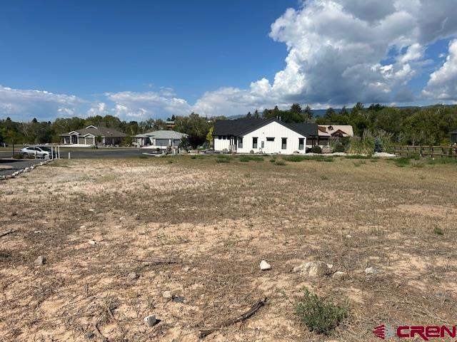 320 Southeast Limestone Court Cedaredge, CO 81413 - Photo 6 of 8 a view of a town with large trees