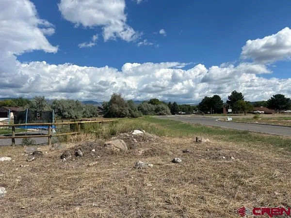 a view of lake with green space