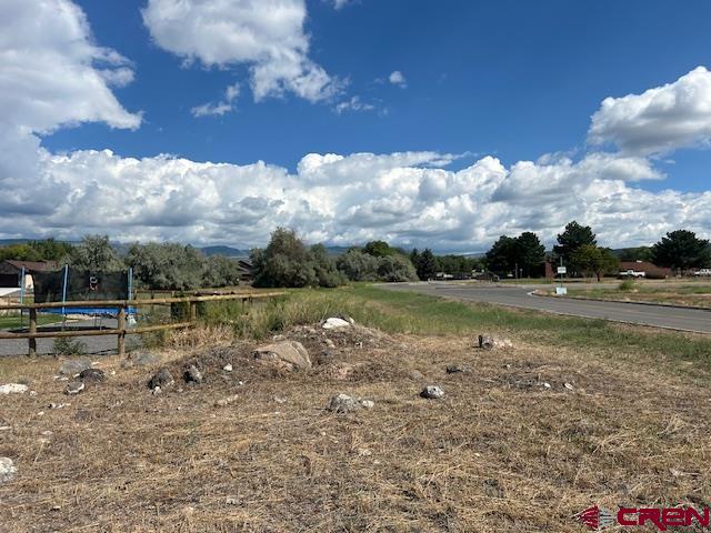 320 Southeast Limestone Court Cedaredge, CO 81413 - Photo 7 of 8 a view of lake with green space