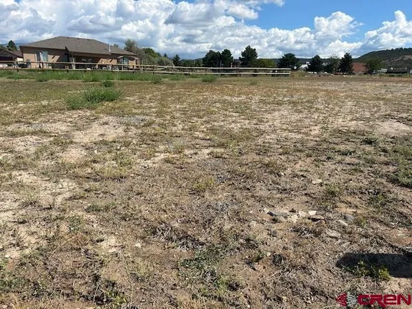 a view of a lake with houses in the background