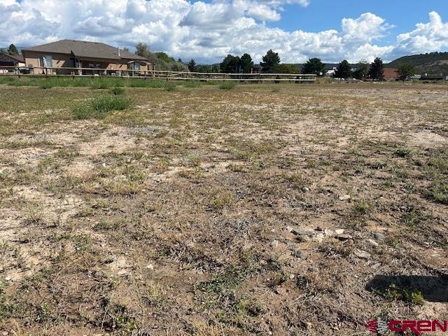 320 Southeast Limestone Court Cedaredge, CO 81413 - Photo 8 of 8 a view of a lake with houses in the background