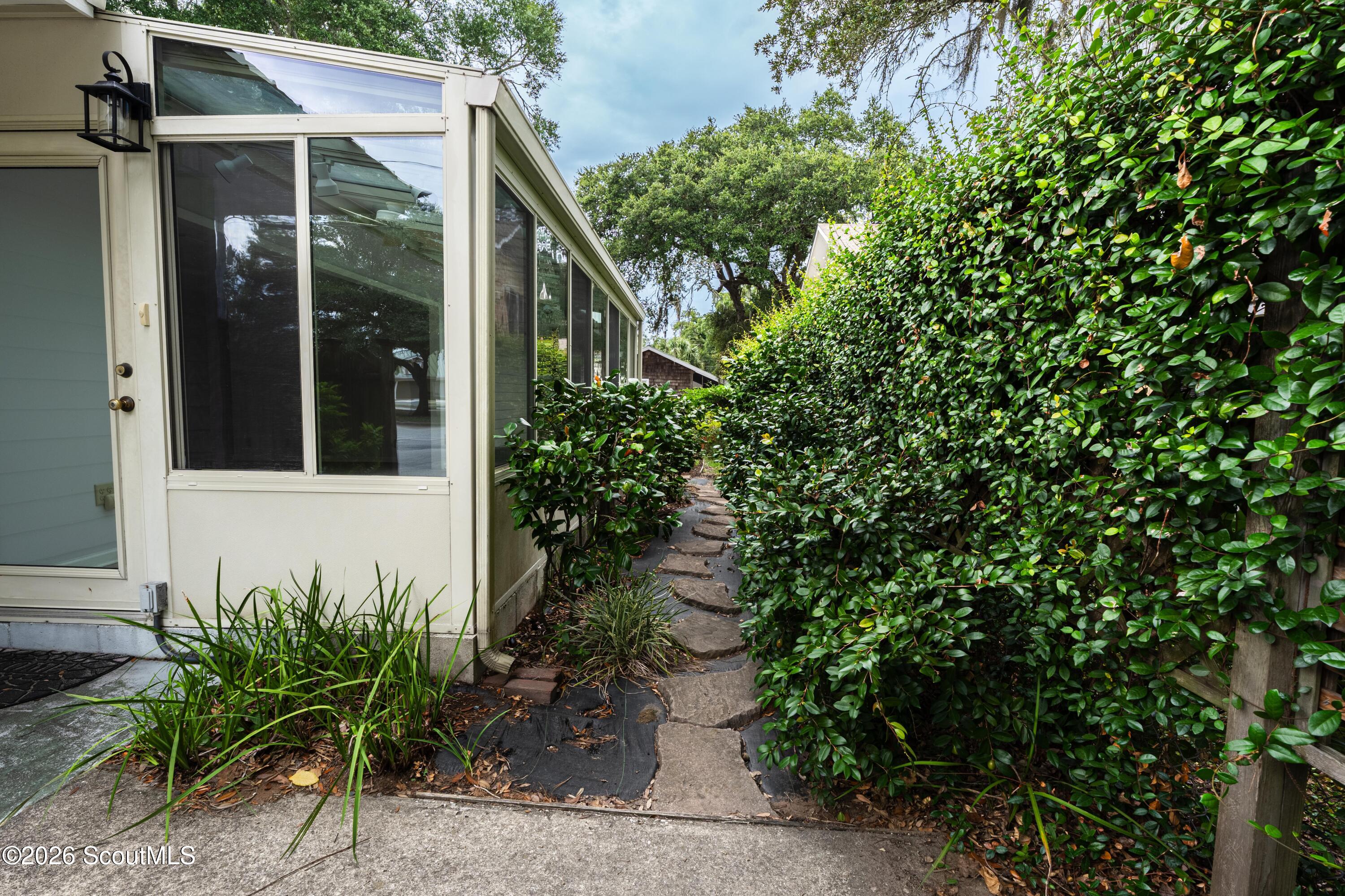 11932 Old Demere Road St. Simons Island, GA 31522 - Photo 4 of 37 path to back yard