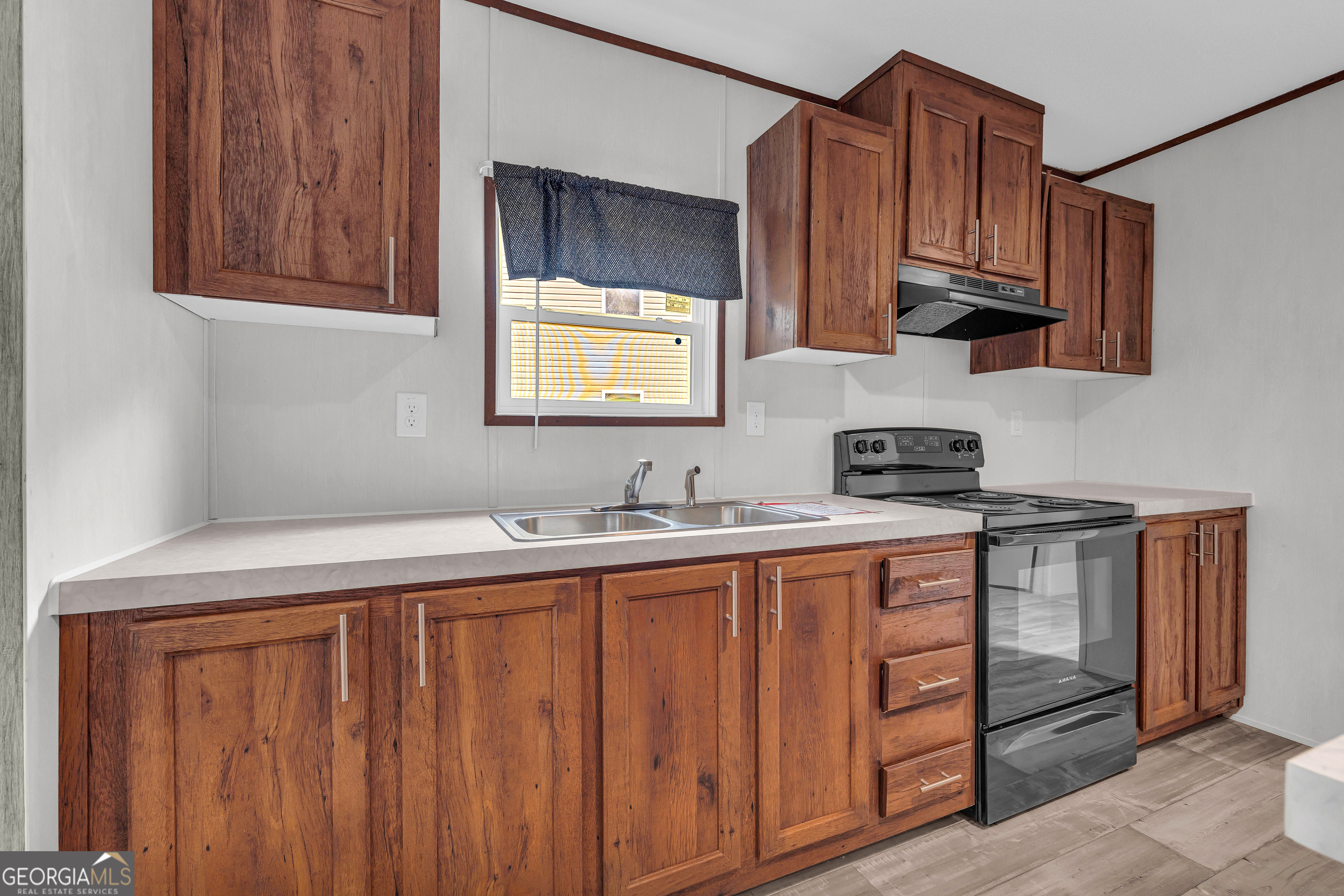 410 Wilson Cemetery Road Nicholson, GA 30565 - Photo 14 of 60 a kitchen with stainless steel appliances granite countertop a sink stove and cabinets