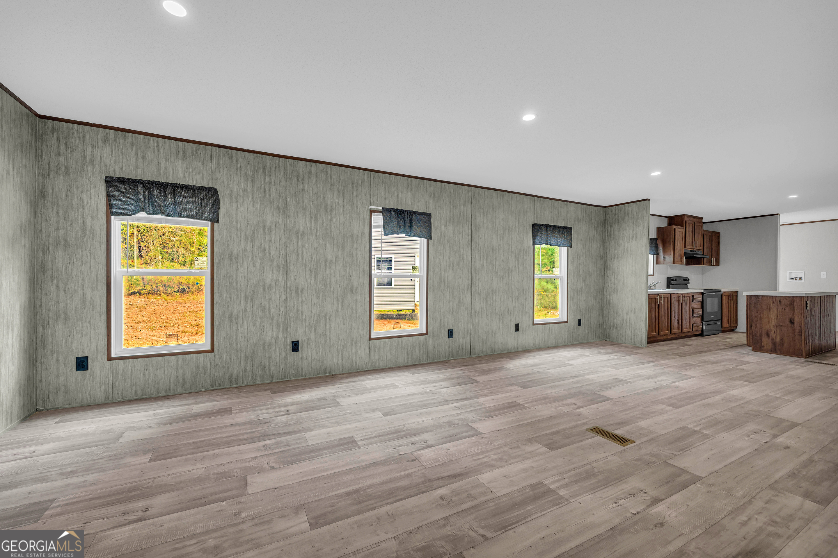 410 Wilson Cemetery Road Nicholson, GA 30565 - Photo 17 of 60 a view of an empty room with a window and a kitchen