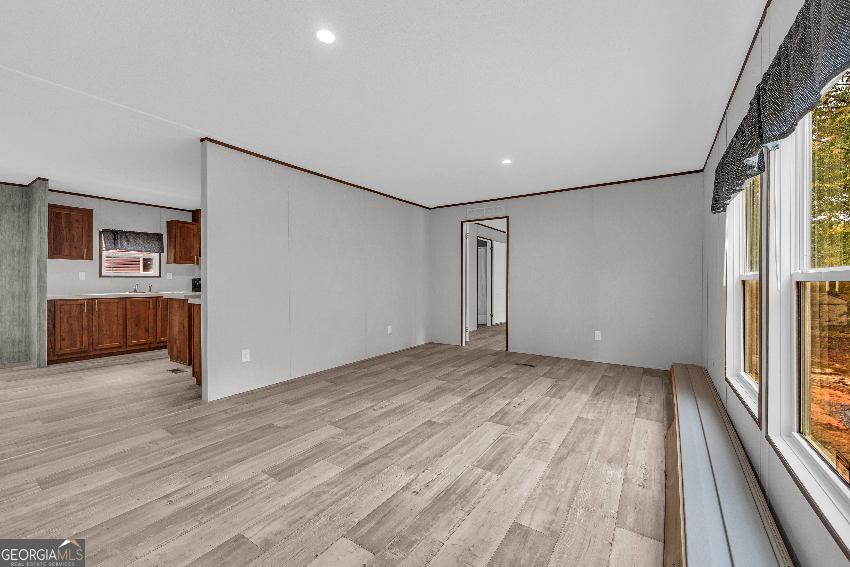 410 Wilson Cemetery Road Nicholson, GA 30565 - Photo 20 of 60 a view of a room with wooden floor staircase and a hallway