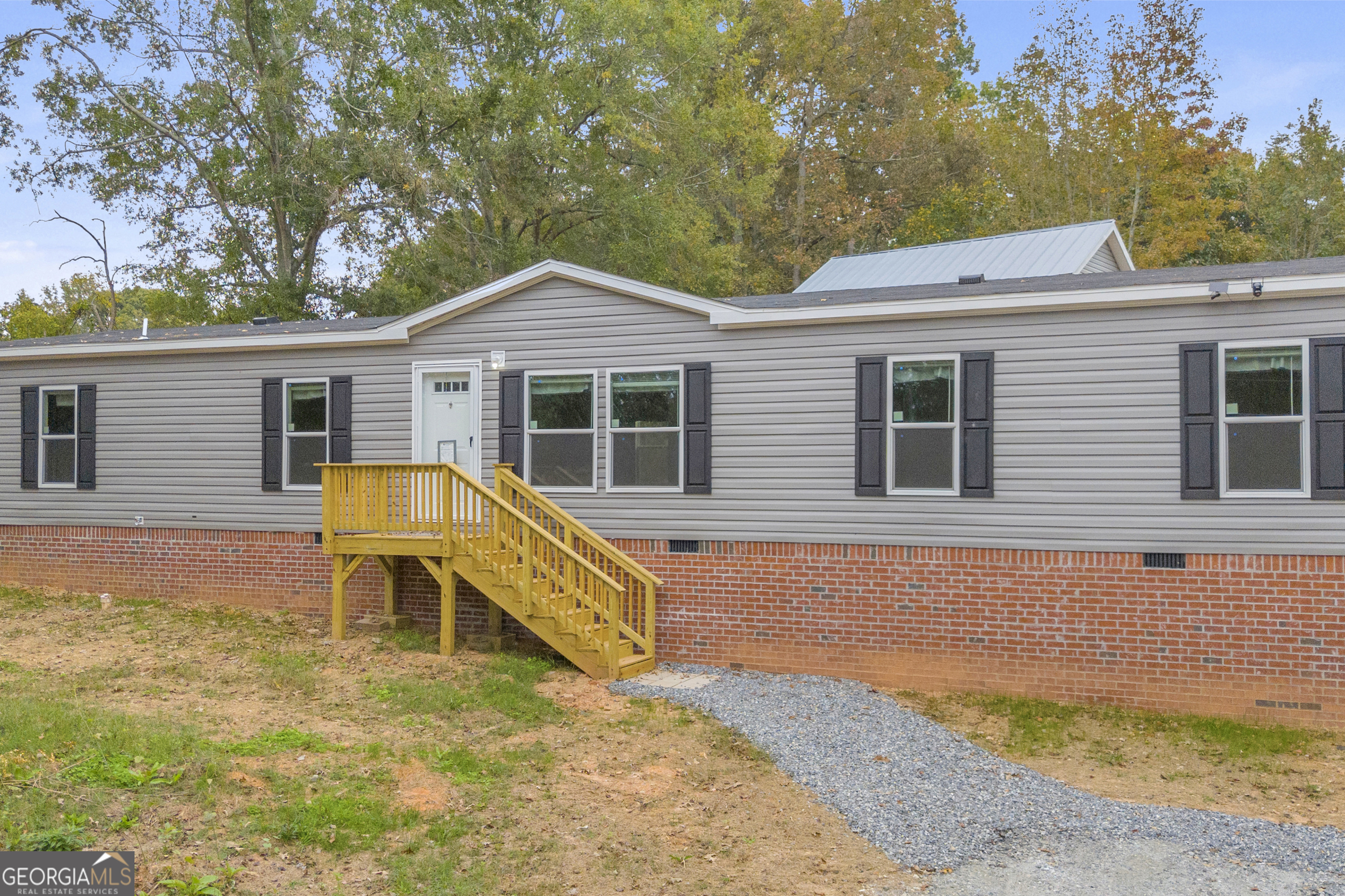 410 Wilson Cemetery Road Nicholson, GA 30565 - Photo 2 of 60 a house view with a outdoor space