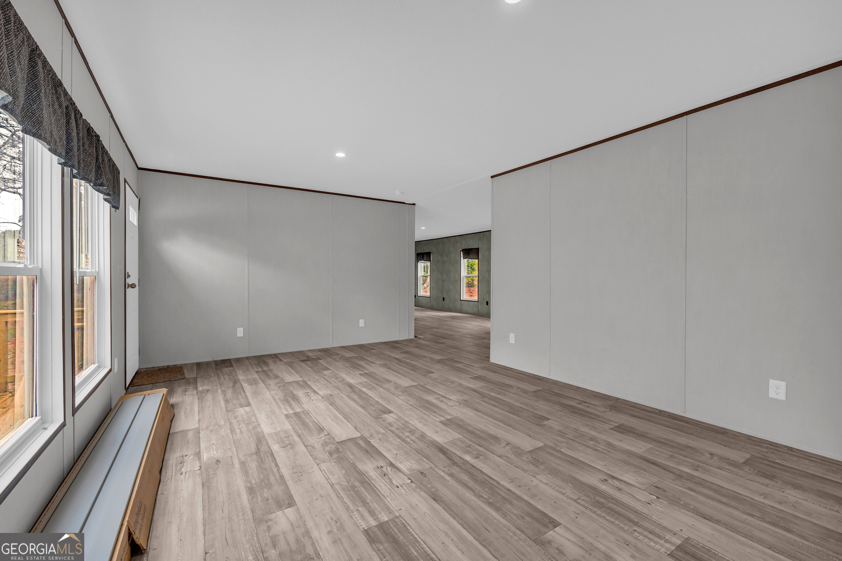 410 Wilson Cemetery Road Nicholson, GA 30565 - Photo 21 of 60 a view of a room with wooden floor and window