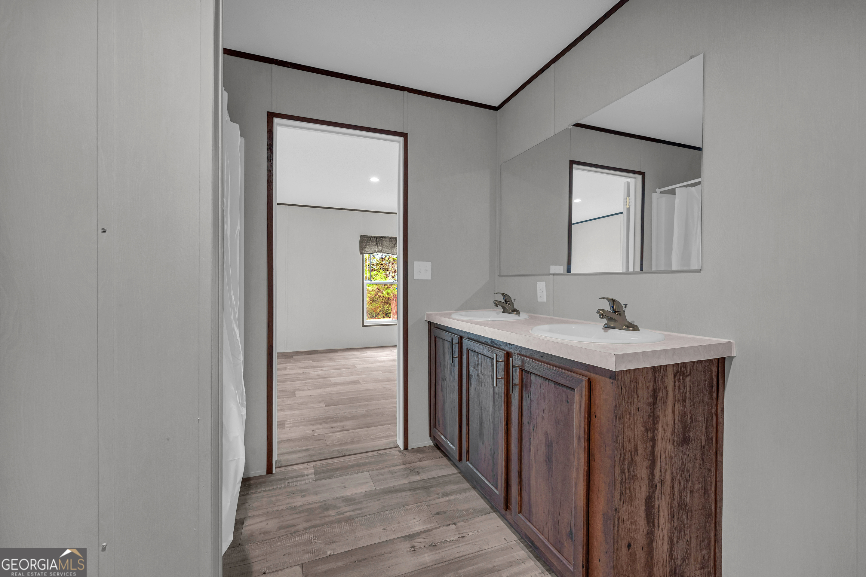 410 Wilson Cemetery Road Nicholson, GA 30565 - Photo 29 of 60 a bathroom with a sink and a mirror