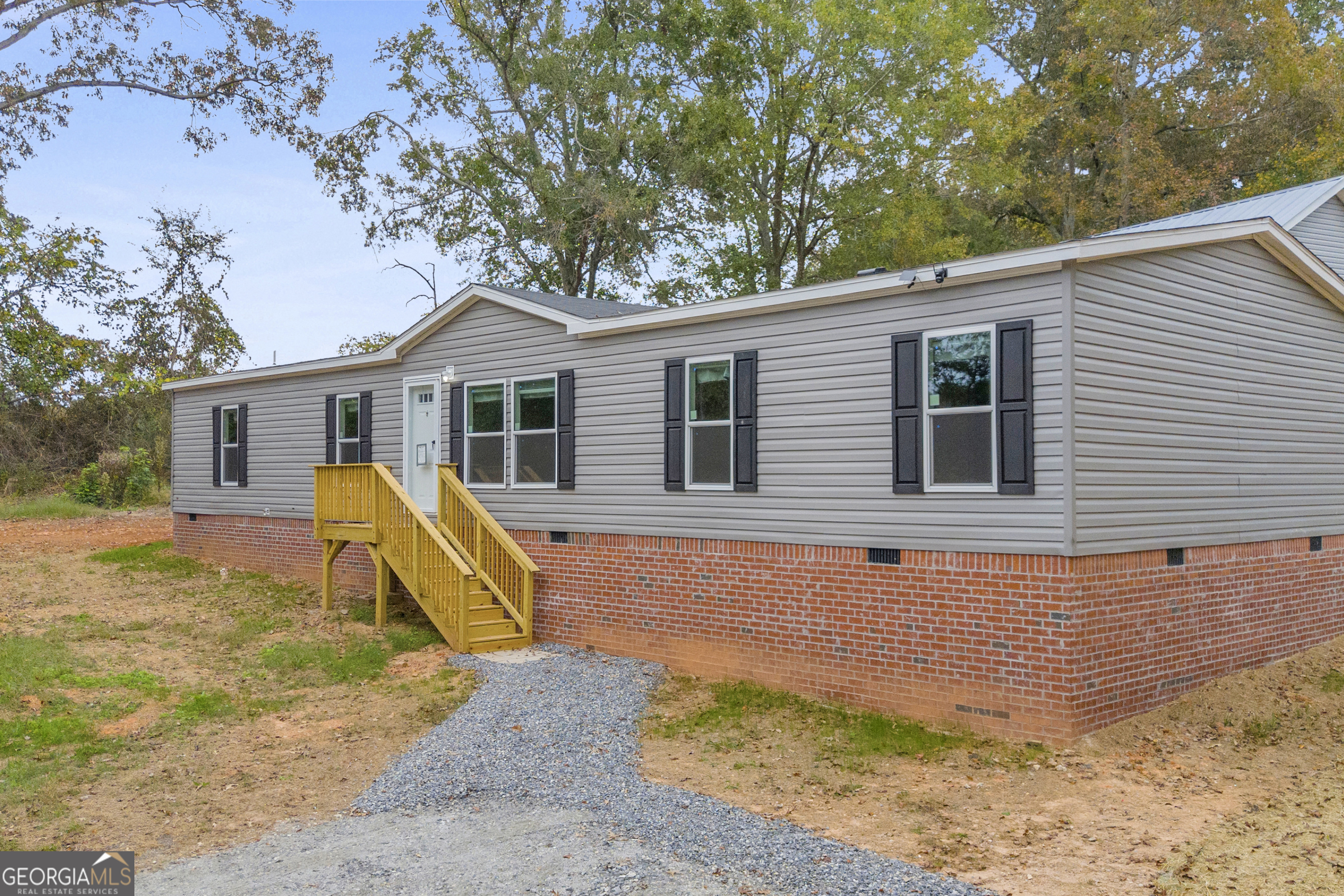 410 Wilson Cemetery Road Nicholson, GA 30565 - Photo 3 of 60 a view of a house with a patio