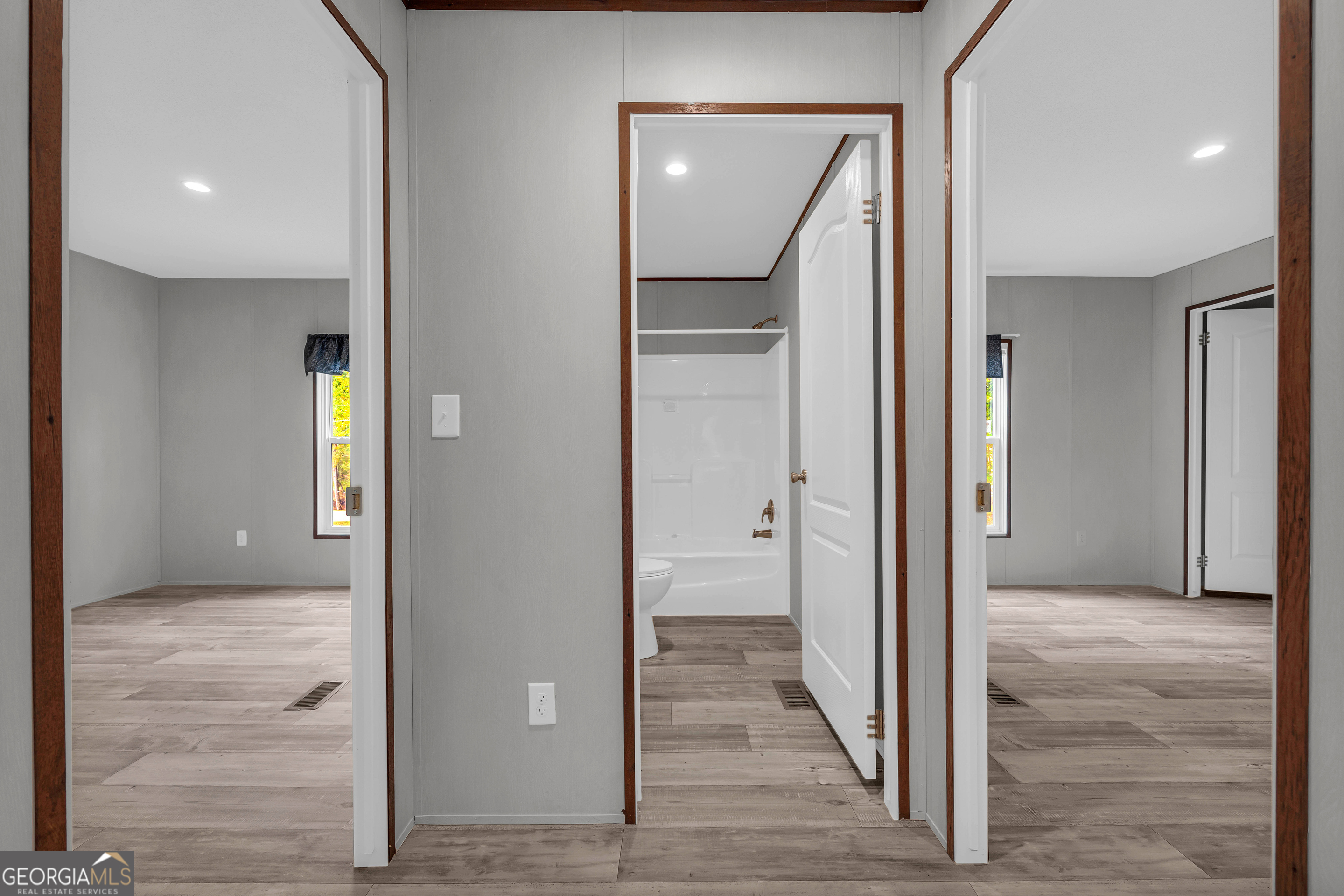 410 Wilson Cemetery Road Nicholson, GA 30565 - Photo 31 of 60 a view of a hallway with wooden floor and closet
