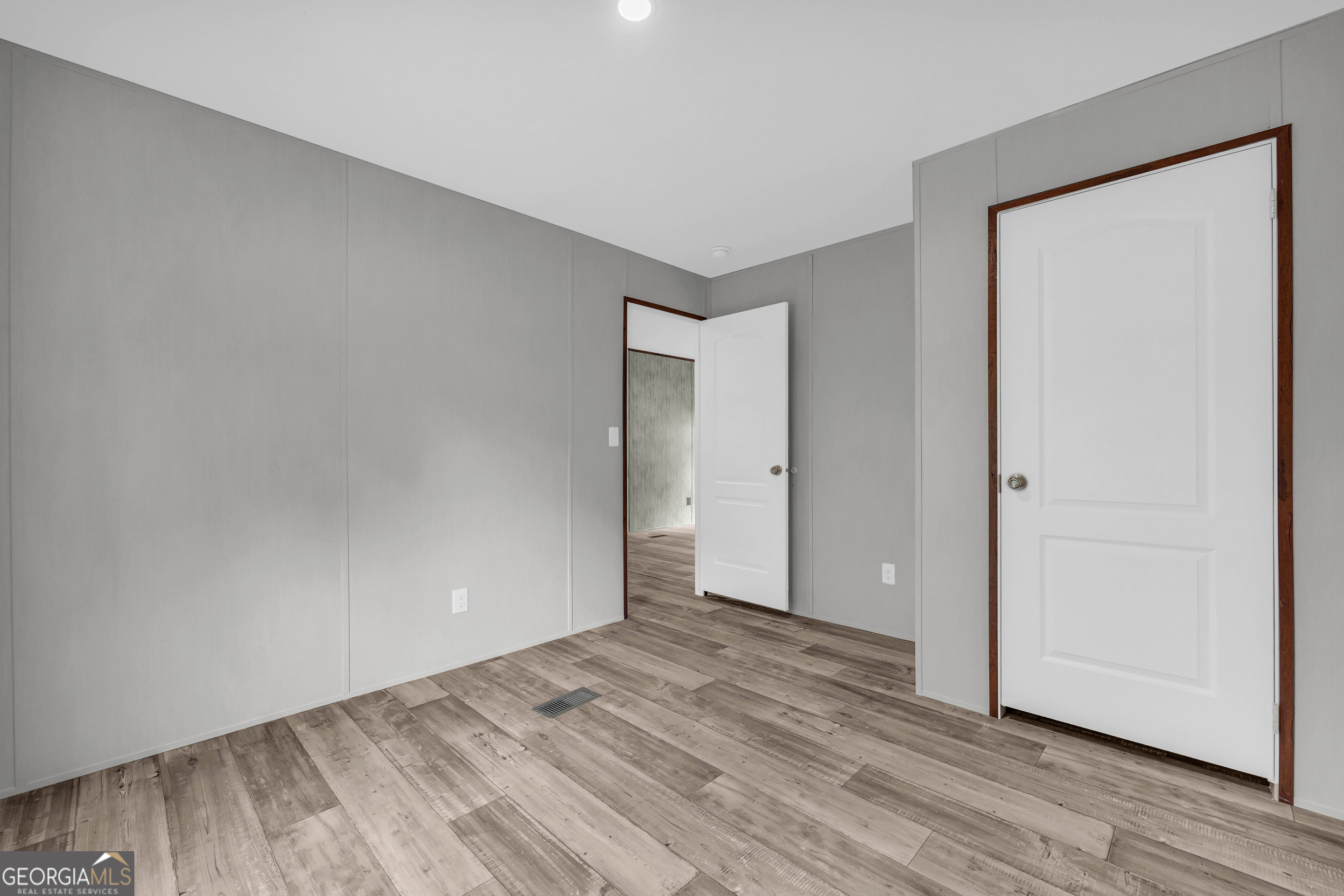 410 Wilson Cemetery Road Nicholson, GA 30565 - Photo 33 of 60 a view of an empty room with wooden floor and closet