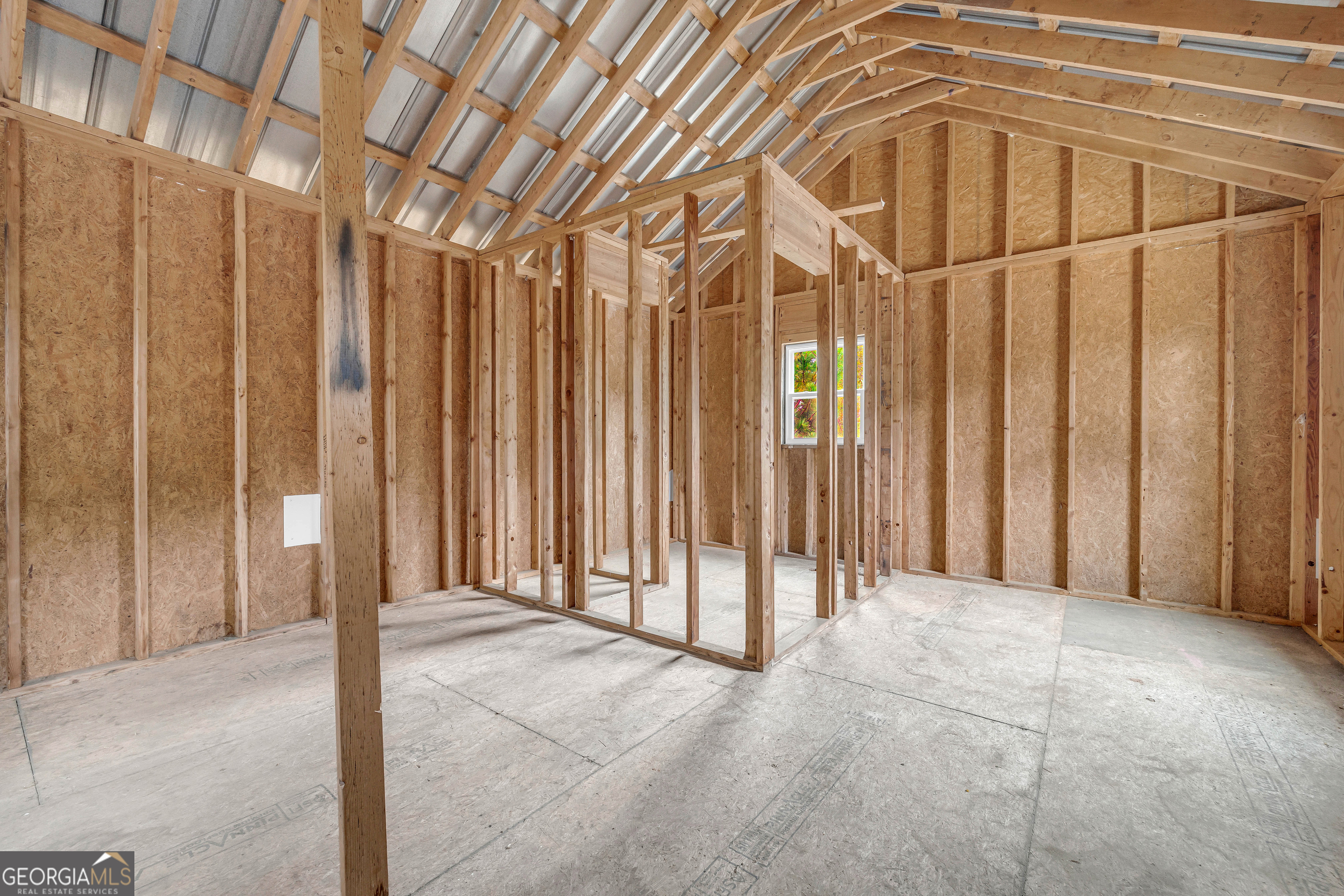 410 Wilson Cemetery Road Nicholson, GA 30565 - Photo 45 of 60 a view of an empty room with wooden walls