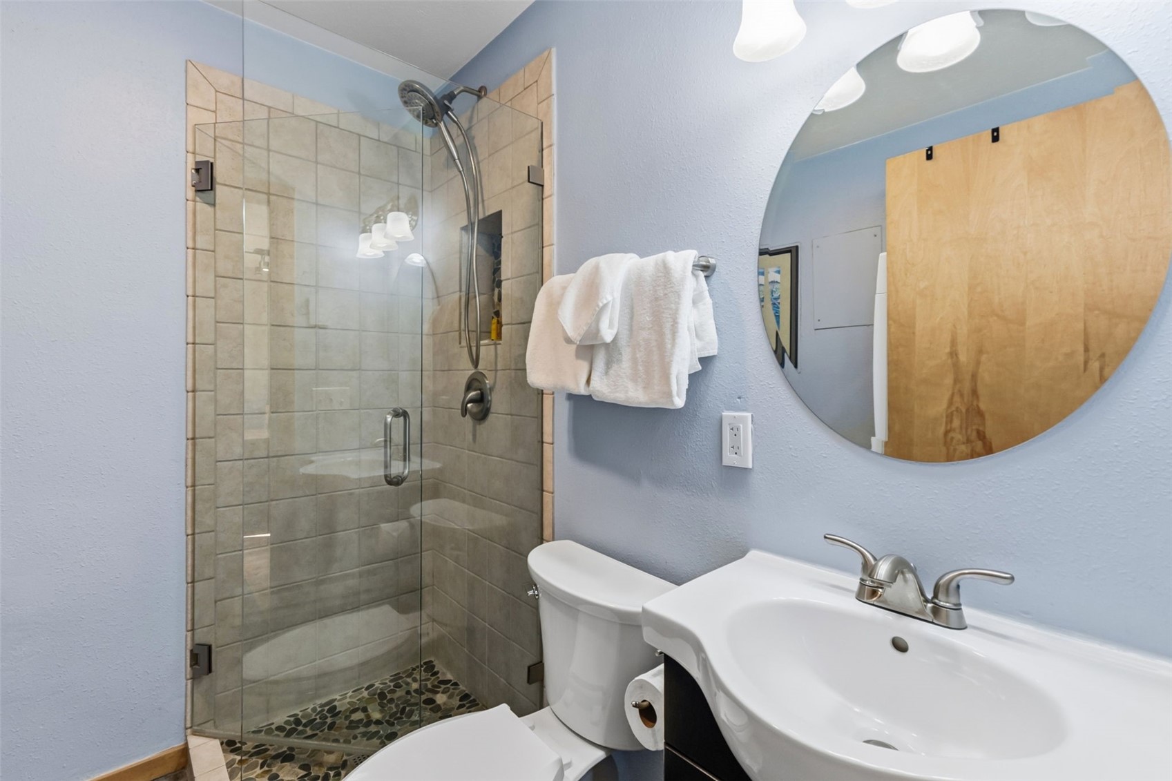 6734 Ryan Gulch Road, Unit 6734 Silverthorne, CO 80498 - Photo 26 of 33 a bathroom with a sink a toilet and shower