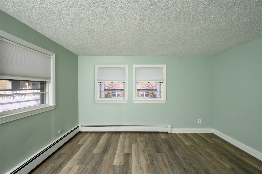 81 Kimball Beach Road Hingham, MA 02043 - Photo 17 of 29 an empty room with wooden floor and window