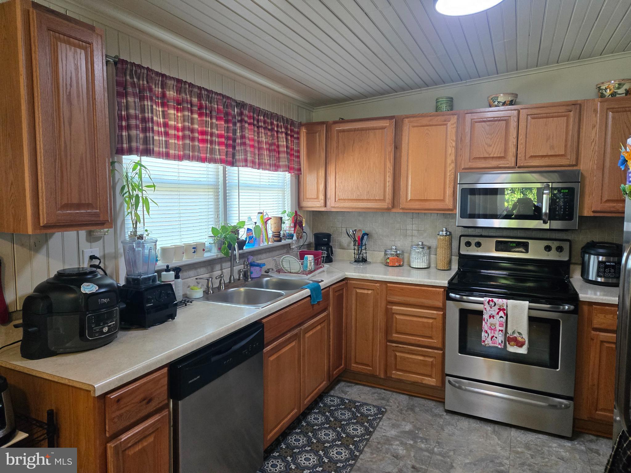 502 South 3rd Avenue Lebanon, PA 17042 - Photo 10 of 27 a kitchen with stainless steel appliances a stove sink microwave and cabinets
