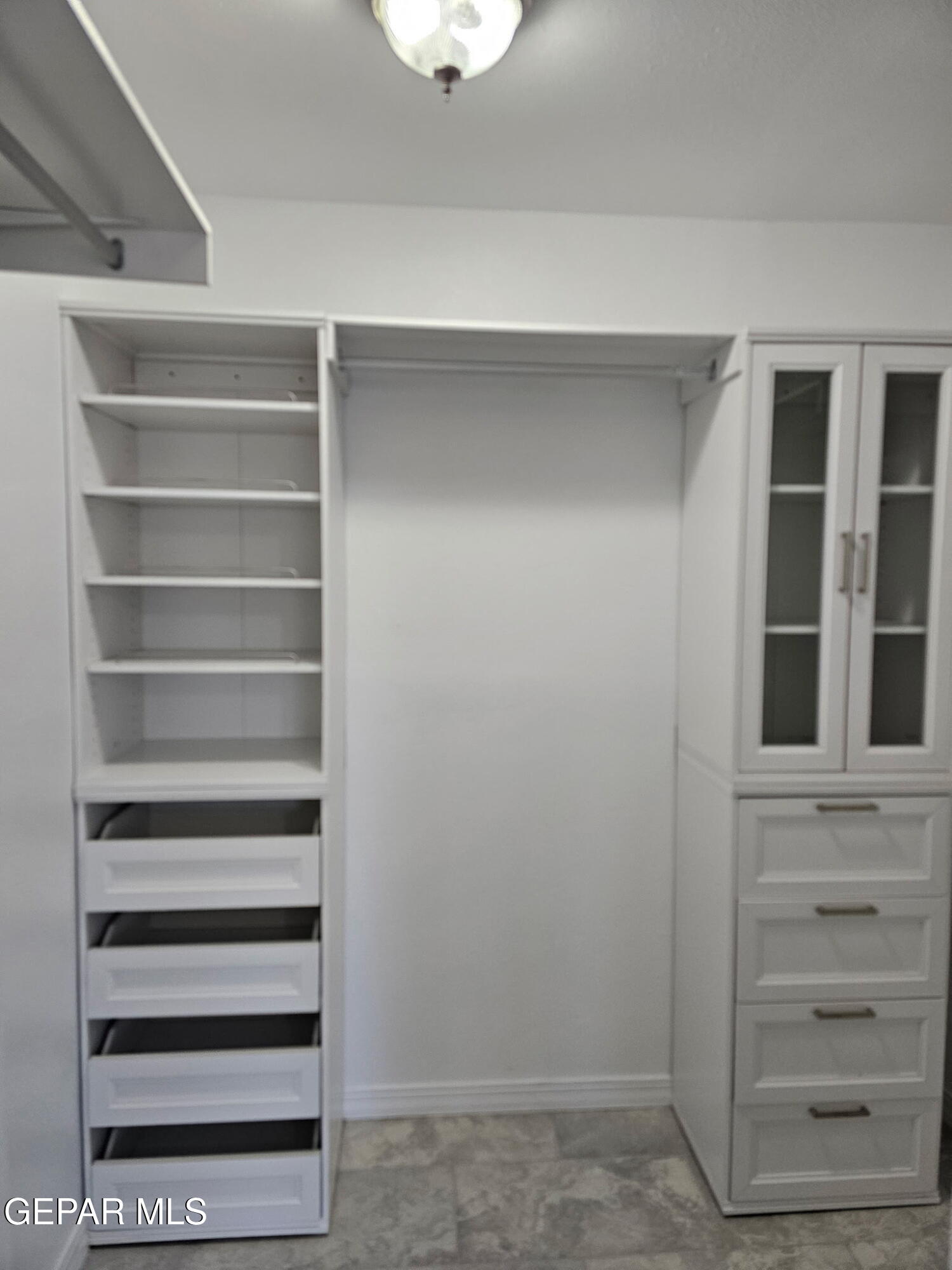 4701 R T Cassidy Drive El Paso, TX 79924 - Photo 14 of 32 a view of walk in closet with empty racks