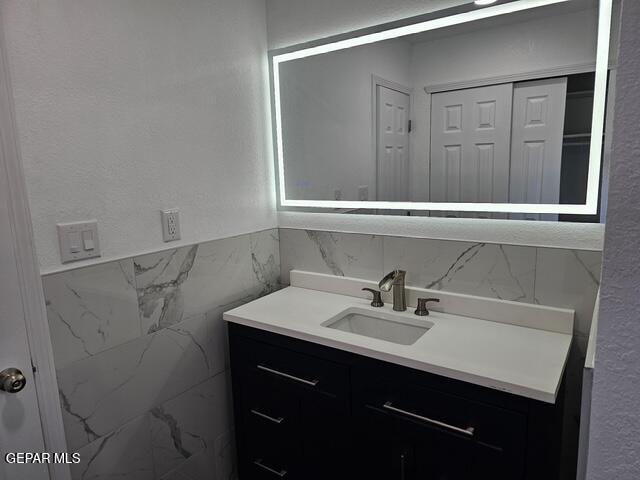 4701 R T Cassidy Drive El Paso, TX 79924 - Photo 17 of 32 a bathroom with a sink and a mirror