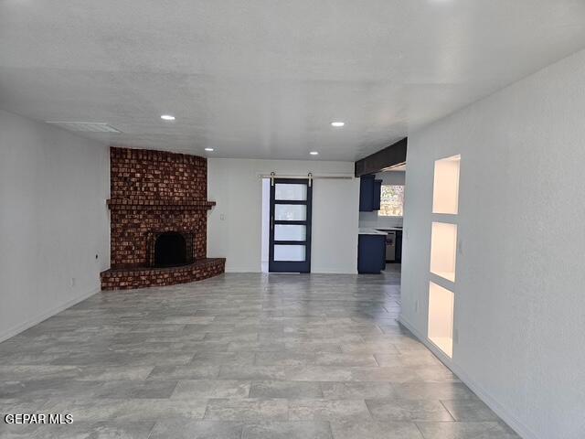 4701 R T Cassidy Drive El Paso, TX 79924 - Photo 22 of 32 a view of an empty room with a fireplace and a window