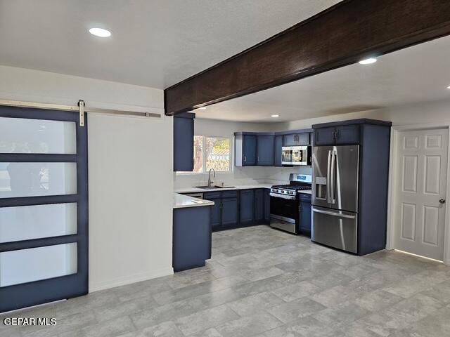 4701 R T Cassidy Drive El Paso, TX 79924 - Photo 25 of 32 a large kitchen with stainless steel appliances kitchen island granite countertop a refrigerator and a sink