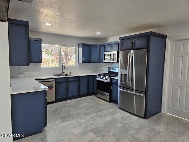 4701 R T Cassidy Drive El Paso, TX 79924 - Photo 26 of 32 a kitchen with stainless steel appliances granite countertop a refrigerator and a sink