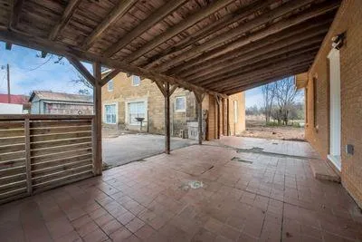 a view of a room with wooden walls
