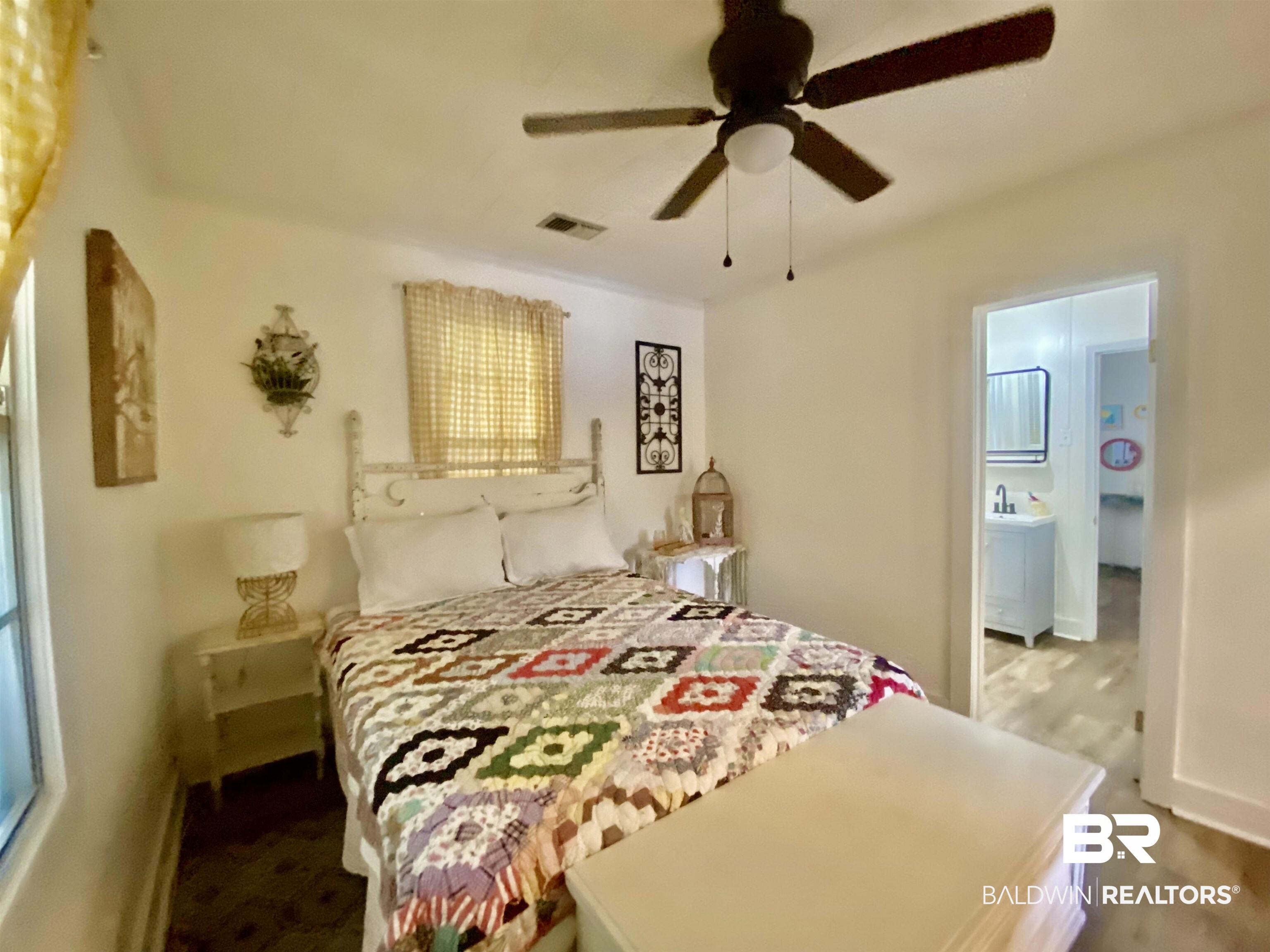 531 Highway 136 Monroeville, AL 36460 - Photo 26 of 48 Bedroom featuring ensuite bath, ceiling fan, and wood-type flooring