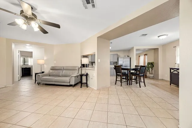 a living room with furniture and a table
