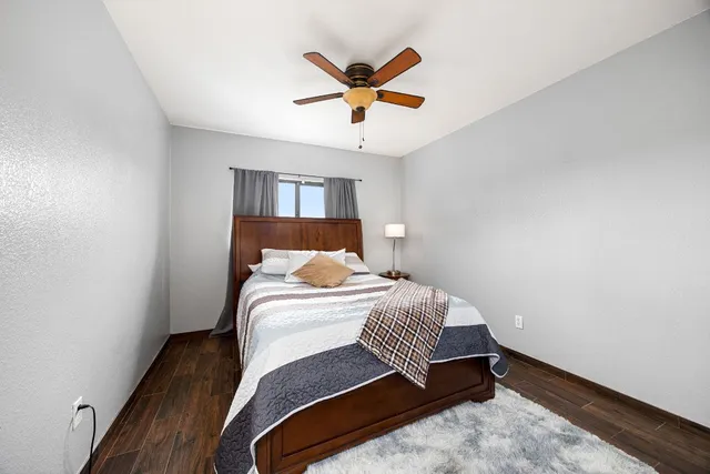 a bedroom with a bed and window