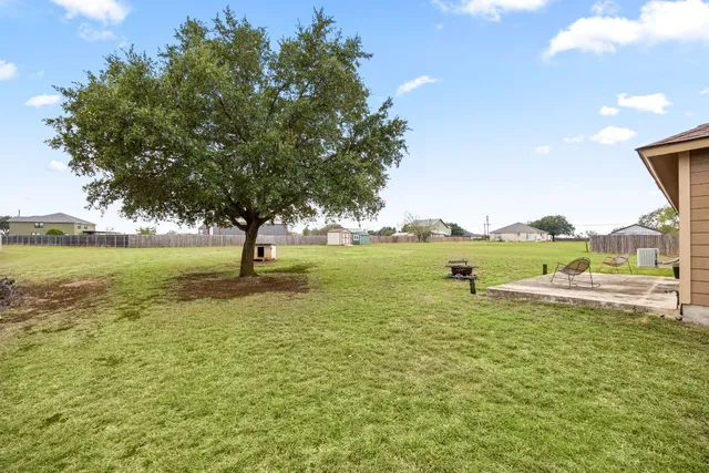 a view of a lake with houses in the back