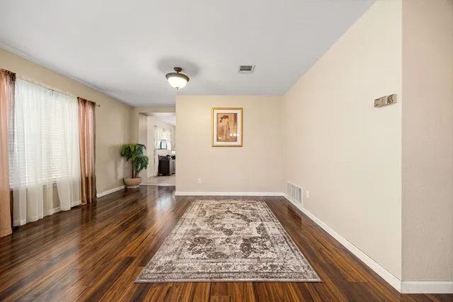 wooden floor in a empty room with a window
