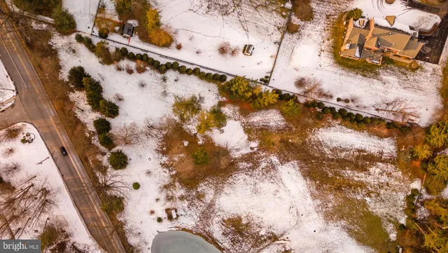 an aerial view of residential building and trees around