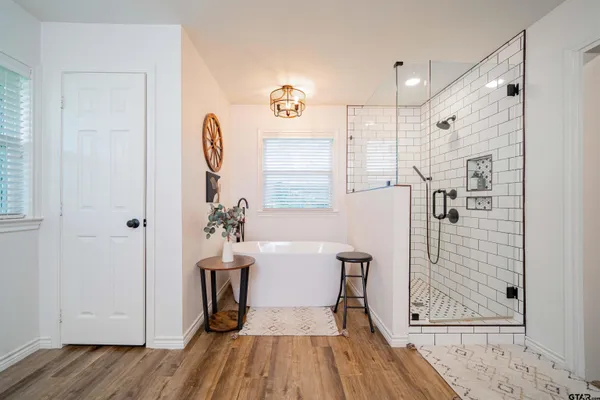 a bathroom with a toilet a sink and a mirror