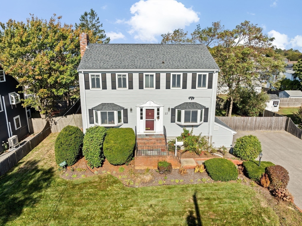 27 Packard Avenue Hull, MA 02045 - Photo 1 of 30 a front view of a house with a yard