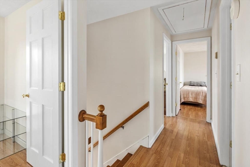 27 Packard Avenue Hull, MA 02045 - Photo 13 of 30 a view of a hallway with wooden floor and stairs