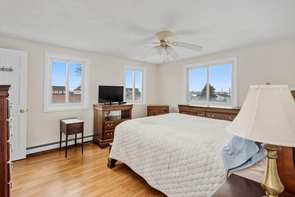 27 Packard Avenue Hull, MA 02045 - Photo 18 of 30 a bedroom with a bed and a flat screen tv