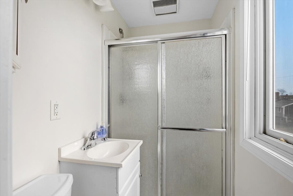 27 Packard Avenue Hull, MA 02045 - Photo 19 of 30 a bathroom with a sink toilet and tub