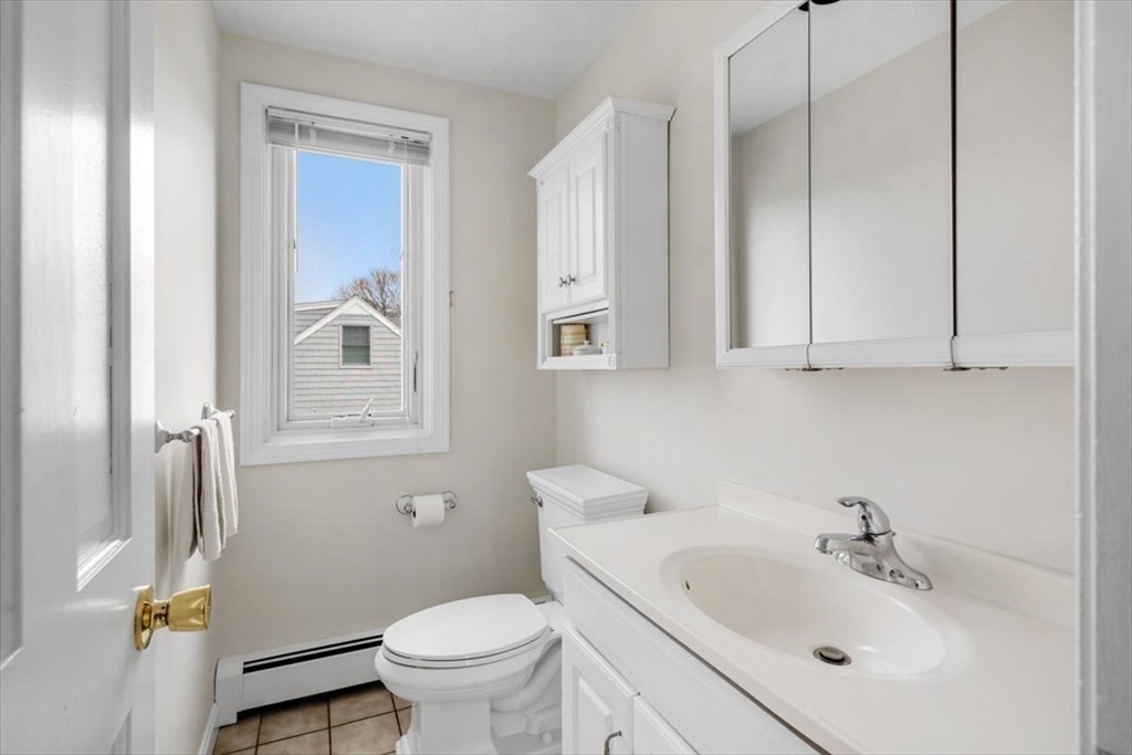 27 Packard Avenue Hull, MA 02045 - Photo 24 of 30 a bathroom with a sink toilet and shower