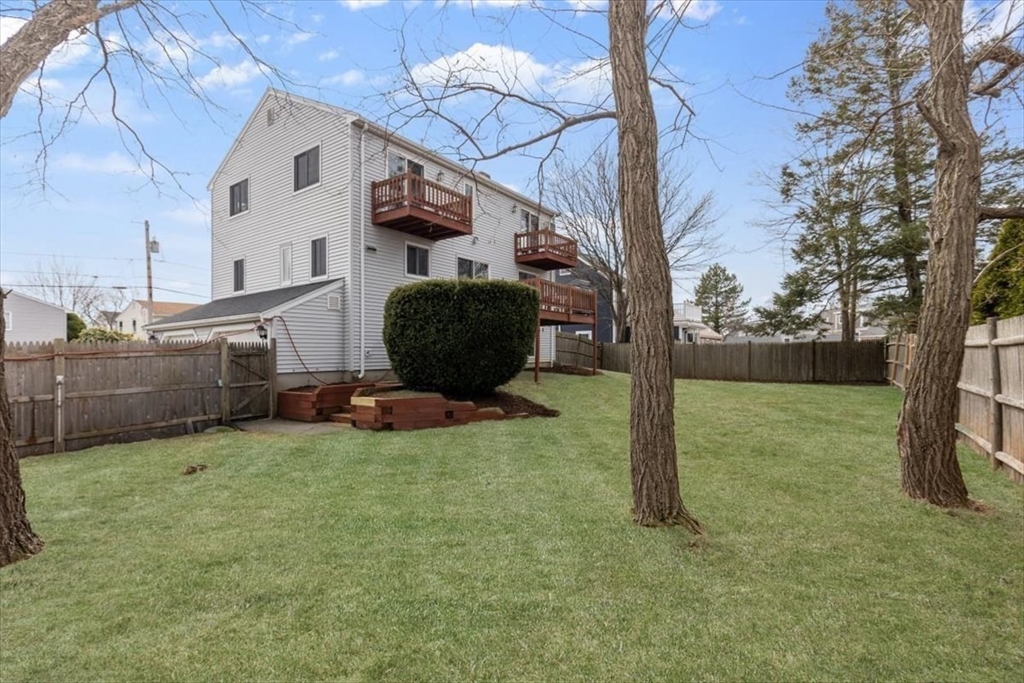 27 Packard Avenue Hull, MA 02045 - Photo 26 of 30 a view of backyard with barbeque grill and a pot