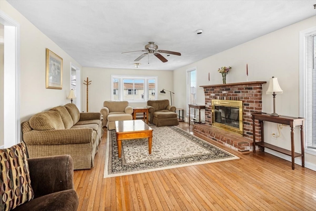 27 Packard Avenue Hull, MA 02045 - Photo 6 of 30 a living room with furniture and a fireplace