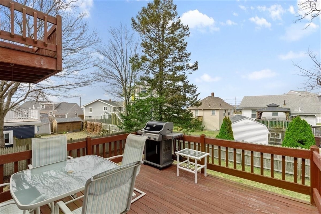 27 Packard Avenue Hull, MA 02045 - Photo 10 of 30 a view of a deck with furniture and a backyard